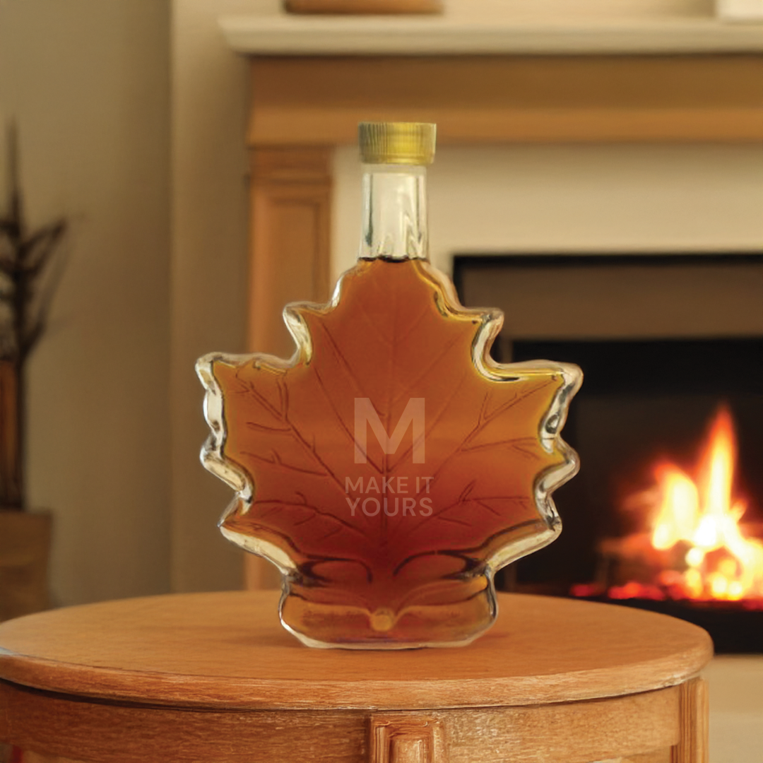 Lifestyle image of maple syrup sitting on wood table by a fireplace