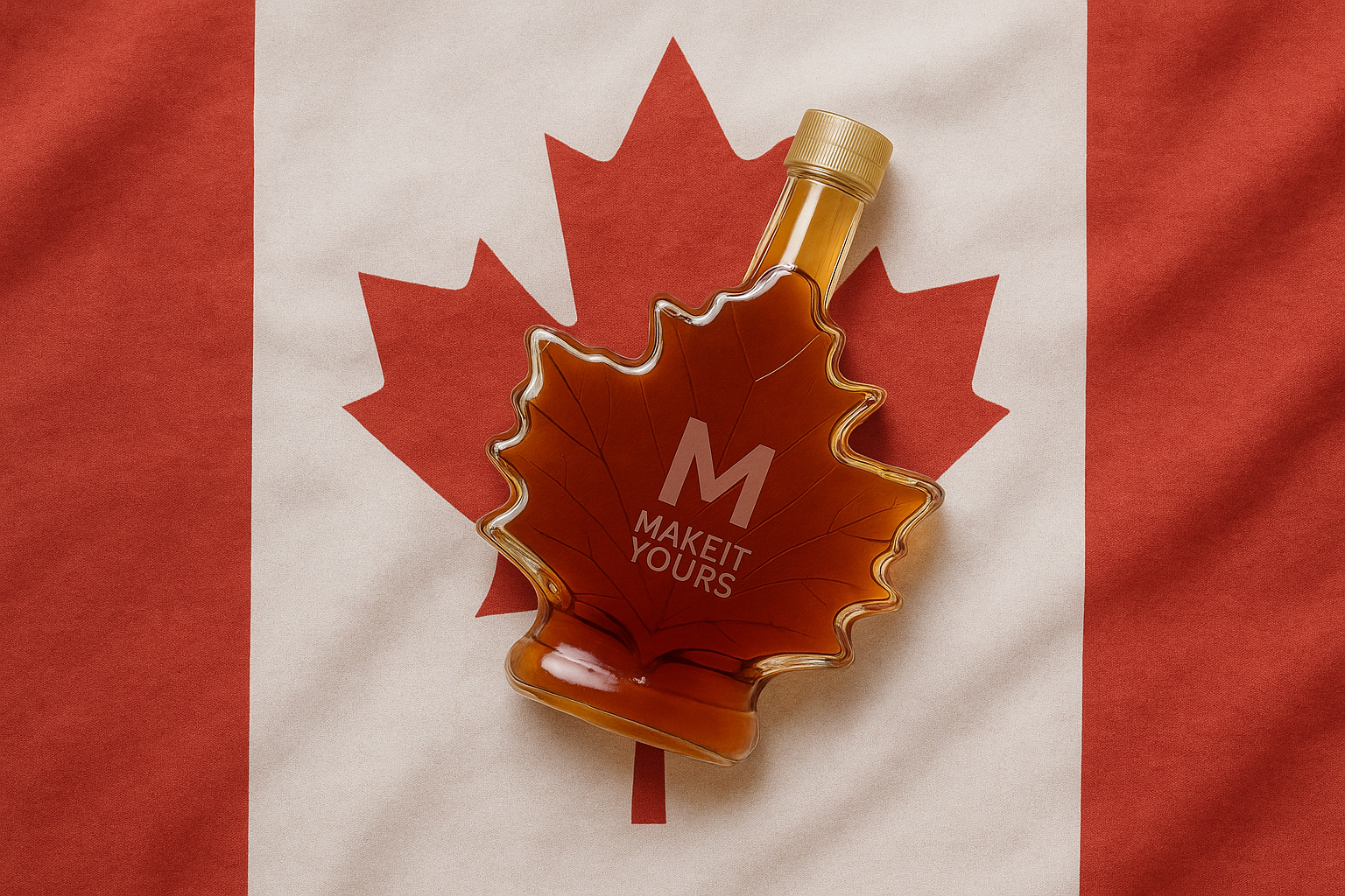 A bottle of maple syrup laying on top of a Canadian Flag