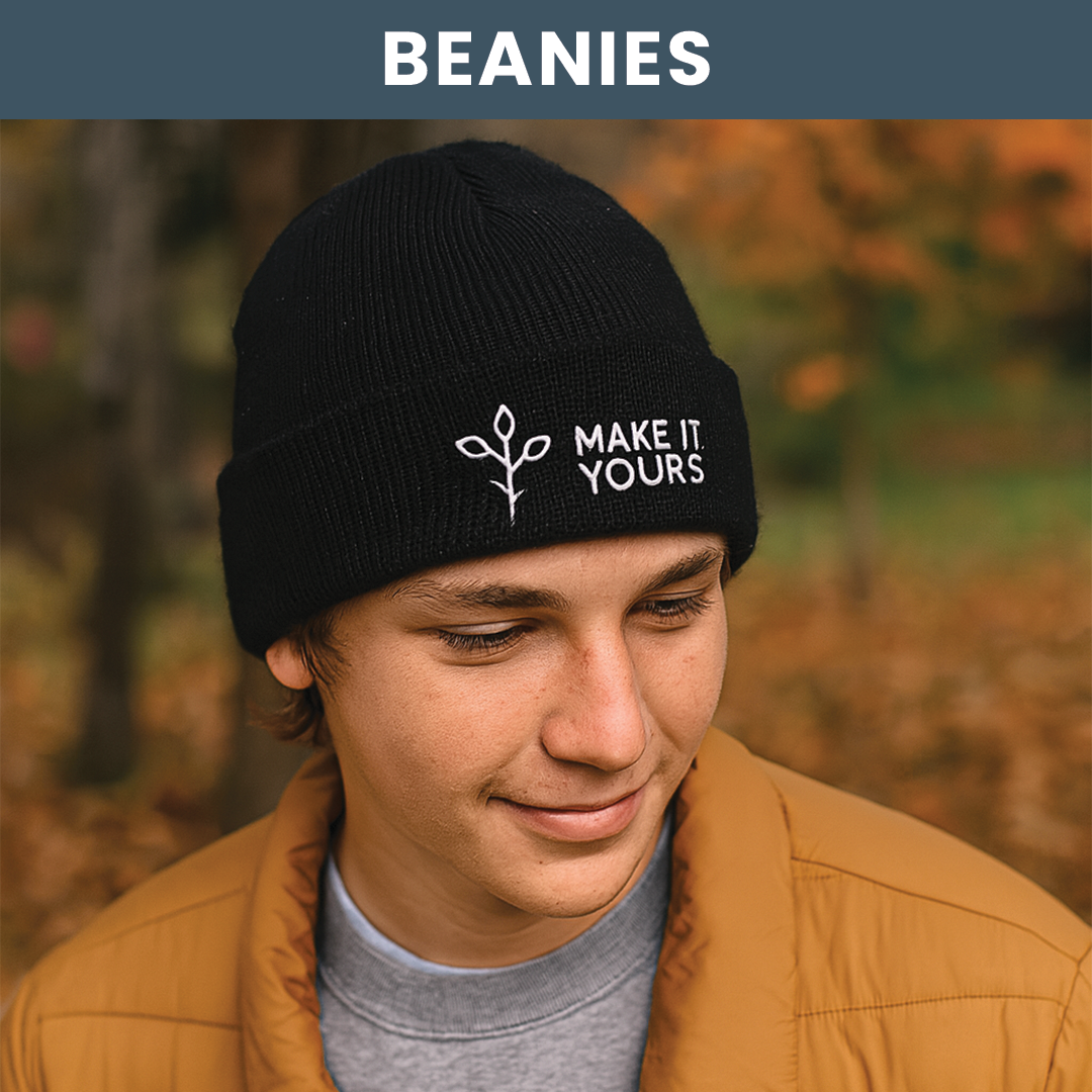 Lifestyle image of man wearing a beanie in a fall hike setting