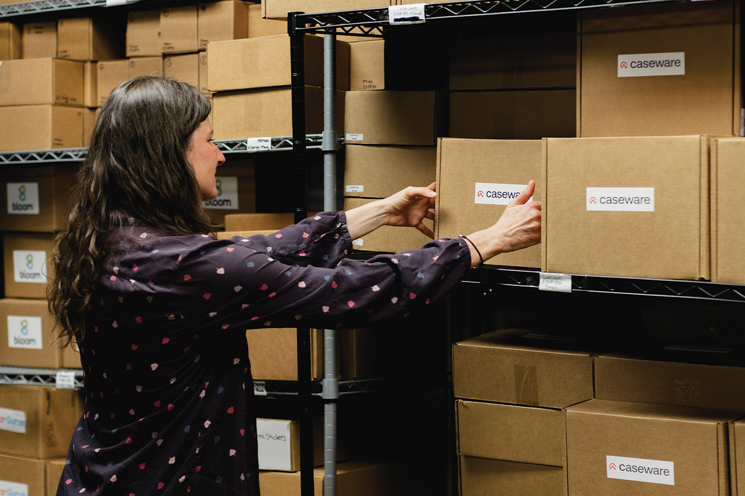 Our fulfillment coordinator organizing swag pack stock in the warehouse Our fulfillment coordinator organizing swag pack stock in the warehouse